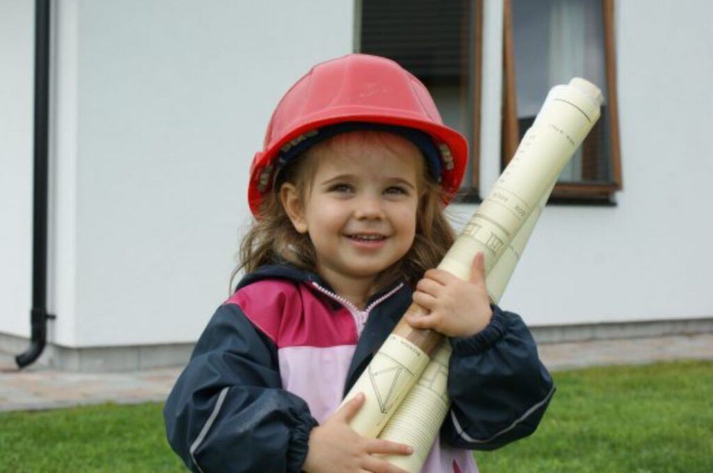 girl with helmet and house drawings at scanhome house